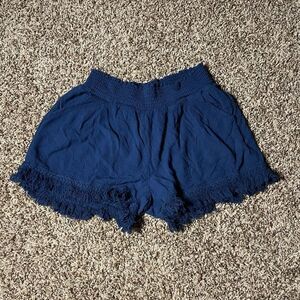 White Crow medium navy blue high rise shorts with pockets.